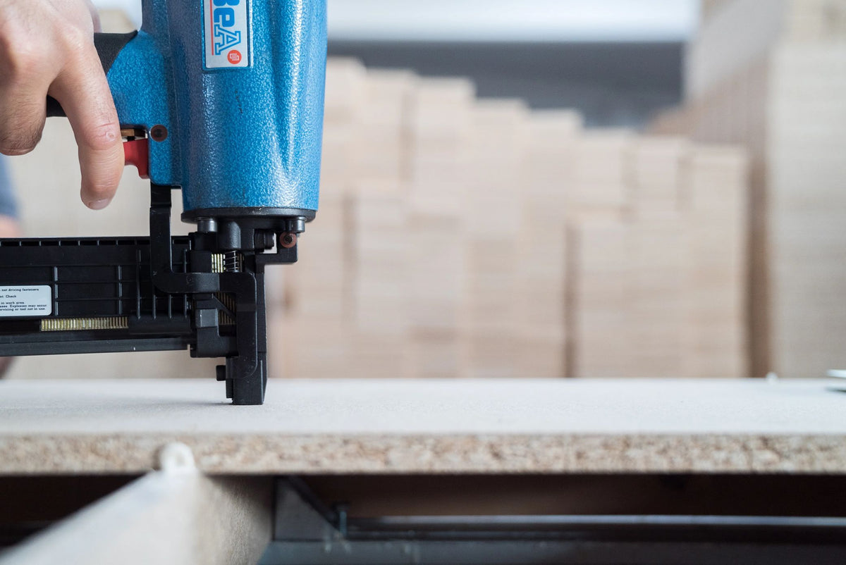 Assembling a sofa frame with a pneumatic stapler