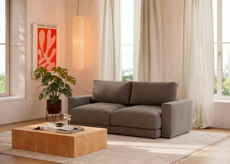 Modular · Tela entrelazada gris en un salón · Sofá de dos módulos