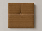 Cabecero modular pana marrón, capitoné con bolsillo a media altura y botón tapizado central. Módulo de 30 × 30 × 3,5 cm.