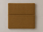 Cabecero modular pana marrón, liso con bolsillo a media altura. Módulo de 30 × 30 × 3,5 cm.