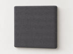 Cabecero modular · Vista del acabado tela tejida gris en un módulo liso de 30 × 30 × 3,5 cm