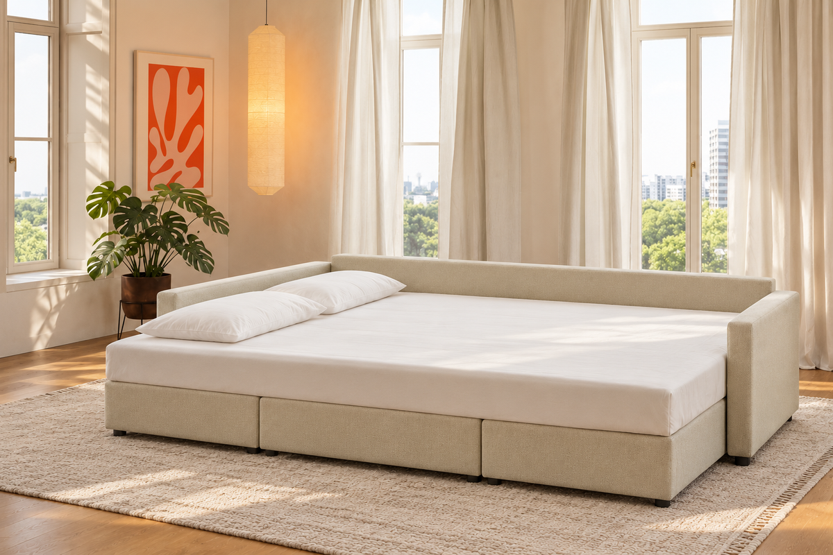 Sette de La Siesta abierto en modo cama, con sábana bajera y dos almohadas, en un salón